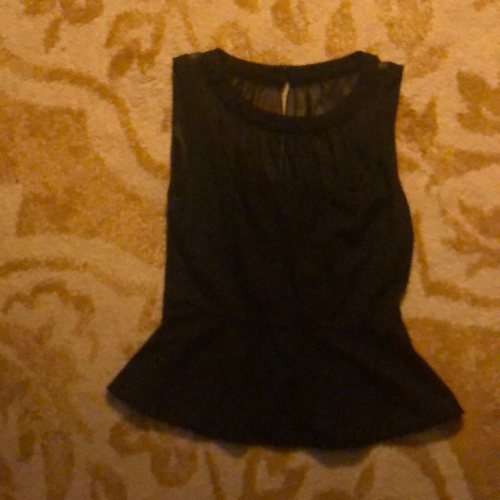 A Bebe blouse.Sheer cleavage and backless.